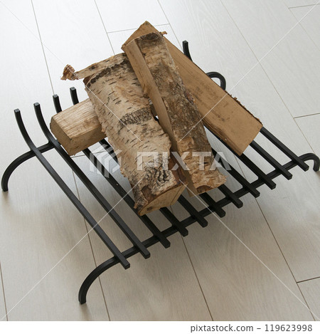 An object photo shoot of black grilles for fireplaces on a light background in the interior. 119623998