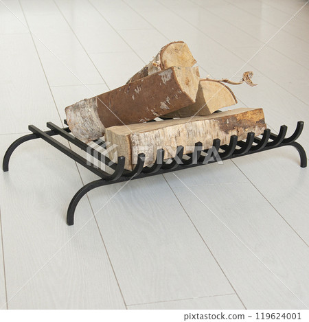 An object photo shoot of black grilles for fireplaces on a light background in the interior. An object photo shoot of black grilles for fireplaces on a light background in the interior. 119624001
