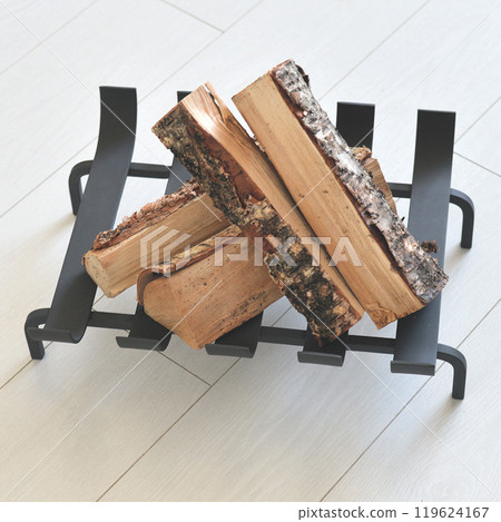 An object photo shoot of black grilles for fireplaces on a light background in the interior. An object photo shoot of black grilles for fireplaces on a light background in the interior. 119624167