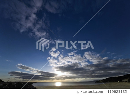 Evening sky with various clouds and sandy beach, winter, ultra-wide angle, sky-focused, 240101pm 119625185