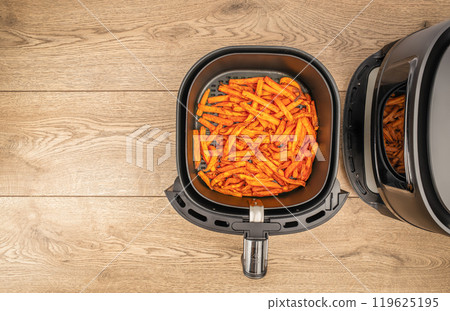 Homemade sweet potato fries roasted in the air fryer. top view. copy space 119625195