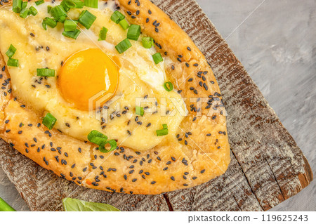 Khachapuri with egg on wooden background. Georgian cuisine. top view. copy space for text 119625243
