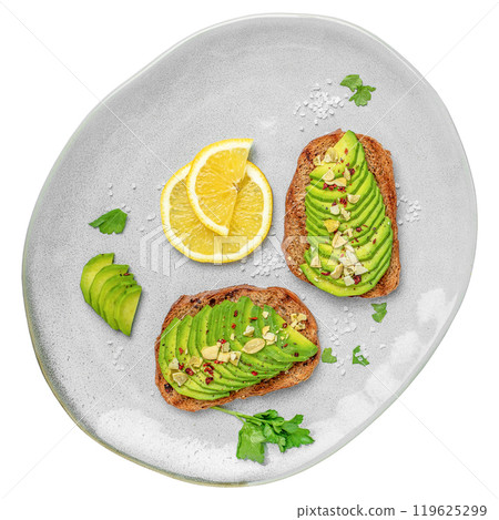 Avocado toasts, healthy breakfast bread with avocado slices on plate isolated on white background. top view Avocado toasts, healthy breakfast bread with avocado slices on plate isolated on white background. top view 119625299