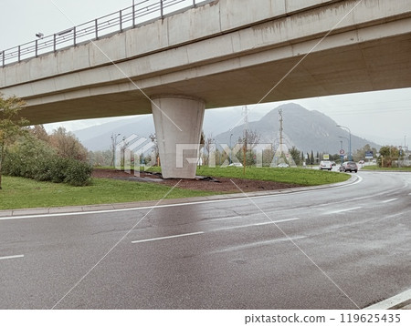 modern concrete bridge on an asphalt road. modern concrete bridge on an asphalt road. 119625435
