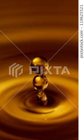 Detail of Dark Golden Liquid Drop Splashing. Detail of Dark Golden Liquid Drop Splashing. 119625521