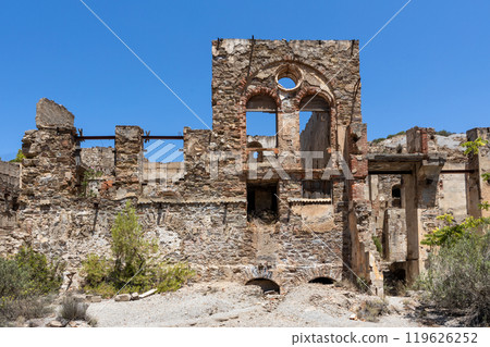 Ruins of an old stone building under a clear sky Ruins of an old stone building under a clear sky 119626252