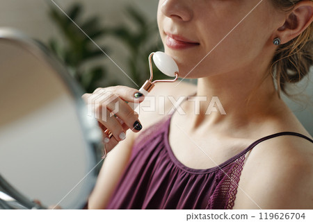 Using Jade Roller for Facial Massage at Home Using Jade Roller for Facial Massage at Home 119626704