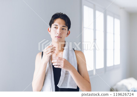 Young man looking in the mirror Young man looking in the mirror 119626724