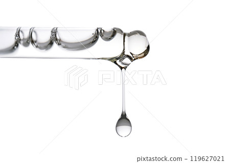 Dropper pipette with delicious serum with bubbles close-up. 119627021