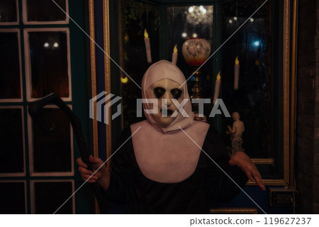 Scary female devilish nun with witch Cane for night Halloween 119627237
