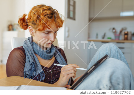 Woman using tablet, e-learning Woman using tablet, e-learning 119627702