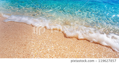 Summer seascape beautiful waves, blue sea water in sunny day, beach with a blue water and white sand Summer seascape beautiful waves, blue sea water in sunny day, beach with a blue water and white sand 119627857