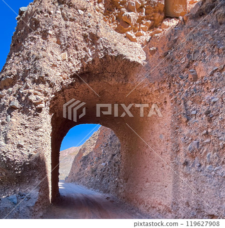 Tunnel opened in the rock on the road to Iruya, Salta, Argentina. 119627908