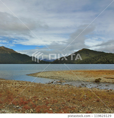 Mountains and Green Lake, Fjordland, New Zealand. 119628129