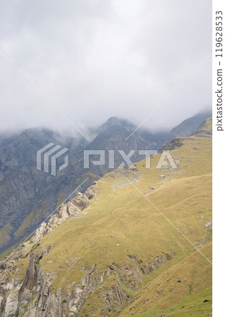Mountain landscape. summer day in wild mountains with coniferous forest and rocky slopes. 119628533