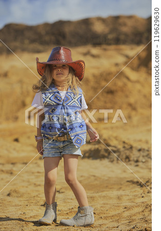 Charming child in a cowboy costume in Denmark 119629630