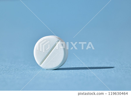 white pill on blue background white pill on blue background 119630464
