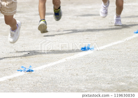 The feet of kindergarten children running at a sports day 119630830