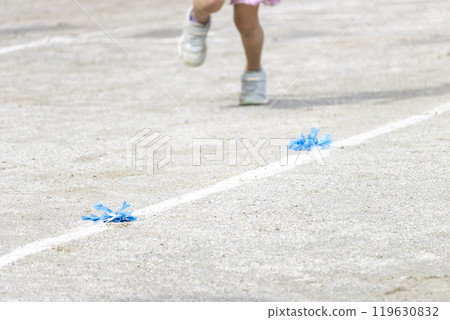 The feet of kindergarten children running at a sports day 119630832