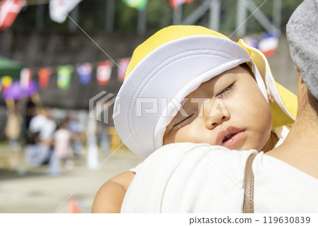 Baby sleeping during a sports day at nursery school (1 year old, boy, Japanese) Baby sleeping during a sports day at nursery school (1 year old, boy, Japanese) 119630839