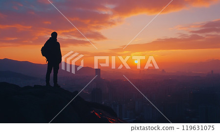 Man watching the sunset over the city 119631075