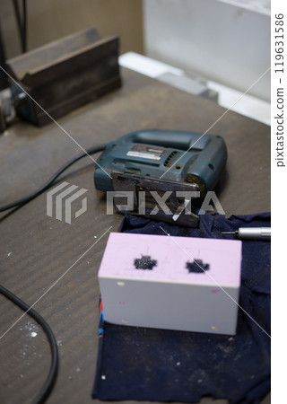 Drilling holes in the control box using a drill press 119631586