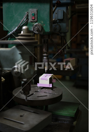 Drilling holes in the control box using a drill press Drilling holes in the control box using a drill press 119631604