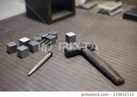 Using a punch and hammer to determine the position for drilling holes Using a punch and hammer to determine the position for drilling holes 119632118