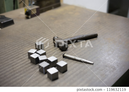 Using a punch and hammer to determine the position for drilling holes Using a punch and hammer to determine the position for drilling holes 119632119