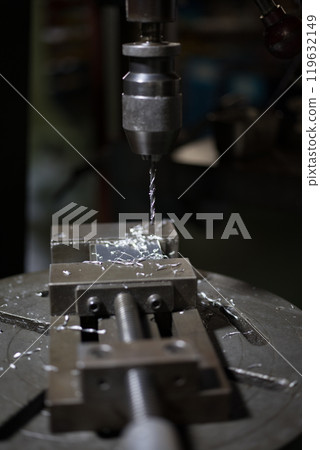 Drilling holes with a drill press Drilling holes with a drill press 119632149