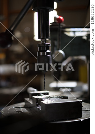Drilling holes with a drill press 119632156