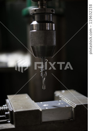 Drilling holes with a drill press 119632158
