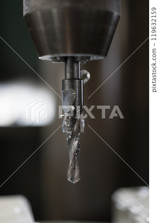 Drilling holes with a drill press Drilling holes with a drill press 119632159