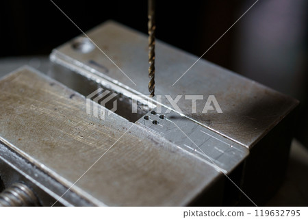 Drilling with drilling machine Drilling with drilling machine 119632795