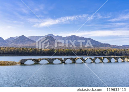 Taushubetsu River Bridge on the former Shihoro Line of the Japanese National Railways on a clear autumn day in Kamishihoro, Hokkaido Taushubetsu River Bridge on the former Shihoro Line of the Japanese National Railways on a clear autumn day in Kamishihoro, Hokkaido 119633413