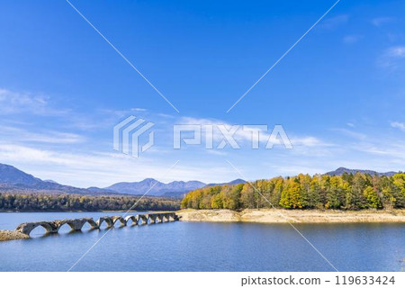 Taushubetsu River Bridge on the former Shihoro Line of the Japanese National Railways on a clear autumn day in Kamishihoro, Hokkaido Taushubetsu River Bridge on the former Shihoro Line of the Japanese National Railways on a clear autumn day in Kamishihoro, Hokkaido 119633424