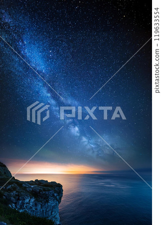 Starry sky over the sea seen from the lighthouse Starry sky over the sea seen from the lighthouse 119633554