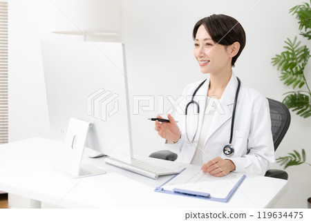 Female doctor doing online medical examination Female doctor doing online medical examination 119634475