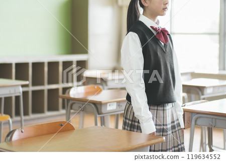 Portrait of a Japanese female junior high school student standing in a classroom 119634552