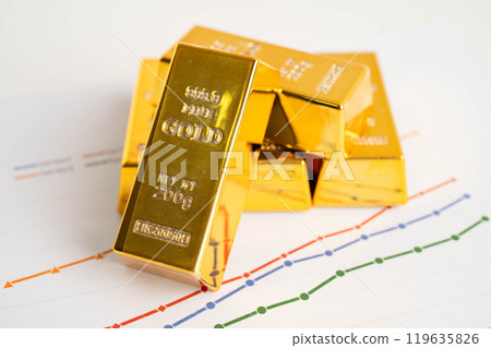 Gold bars on US dollar banknote money, finance trading investment business currency concept. Gold bars on US dollar banknote money, finance trading investment business currency concept. 119635826