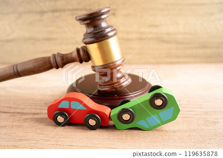 Car accident lawsuit and insurance, Judge hammer with car model. Car accident lawsuit and insurance, Judge hammer with car model. 119635878