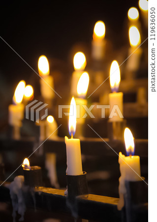 Stunning array of glowing candles forming rows and casting warm light, ideal for creating a peaceful and spiritual ambiance. Perfect for meditation, reflection, or romantic settings Stunning array of glowing candles forming rows and casting warm light, ideal for creating a peaceful and spiritual ambiance. Perfect for meditation, reflection, or romantic settings 119636050