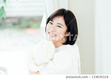 Woman holding a baby 119636328