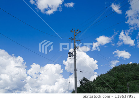 Blue sky, summer clouds and electric pole 119637955