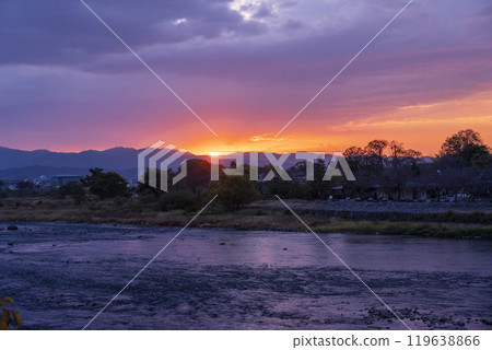 The sun rises and illuminates the Katsura River in the early autumn morning. The sun rises and illuminates the Katsura River in the early autumn morning. 119638866
