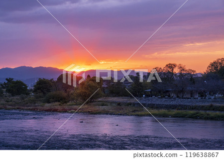 The sun rises and illuminates the Katsura River in the early autumn morning. The sun rises and illuminates the Katsura River in the early autumn morning. 119638867