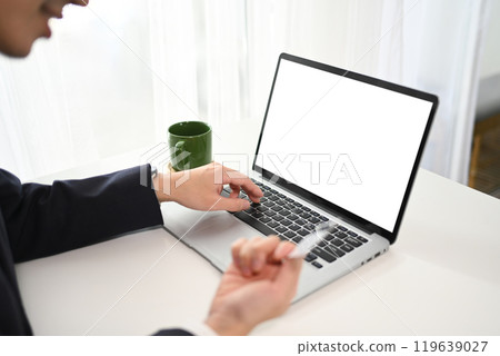 Close up shot businessman making a purchase or payment with credit card online 119639027