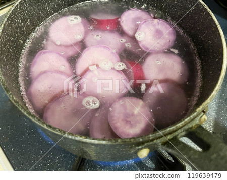 Boil purple sweet potato in a pot 119639479