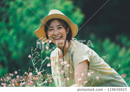 A woman picking saponaria in a flower field A woman picking saponaria in a flower field 119639925