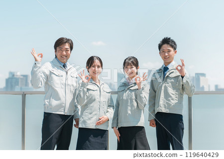 Male and female staff in the manufacturing, building, transportation, and construction industries wearing work clothes. Male and female staff in the manufacturing, building, transportation, and construction industries wearing work clothes. 119640429